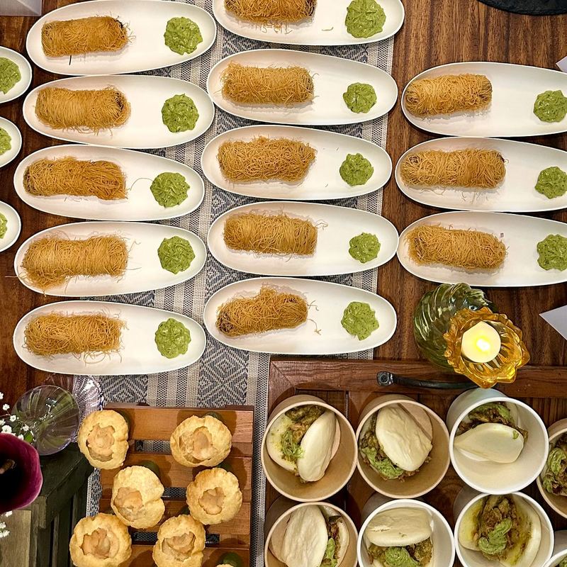 Canapés served on white tasting spoons