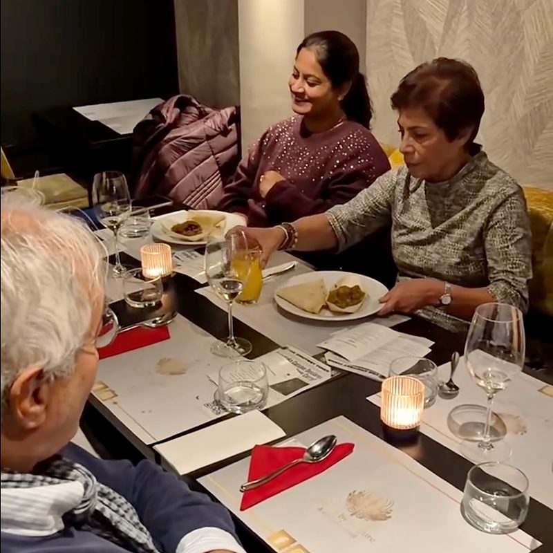 Guests at a candlelit table during a Karnataka-themed tasting dinner