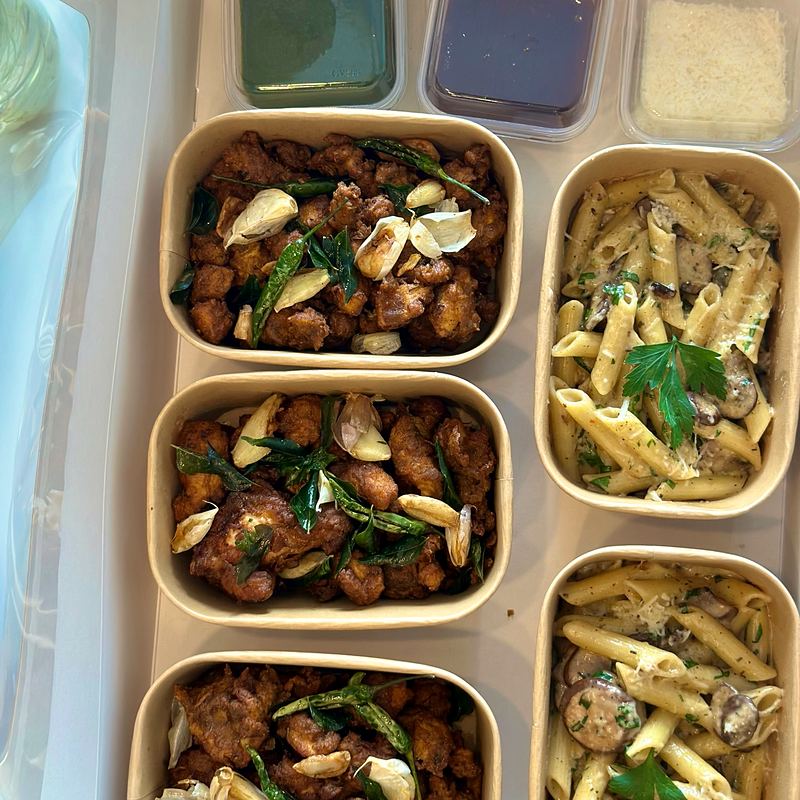 Party boxes of chicken and pasta for a house party